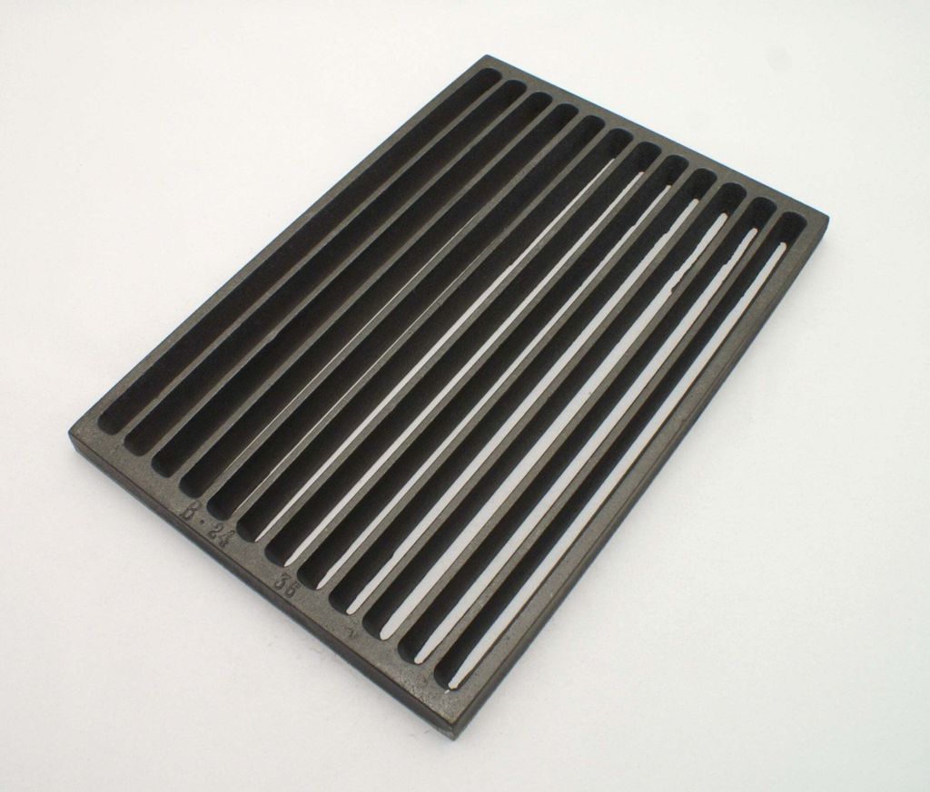 A cast iron grill grate on a white background.