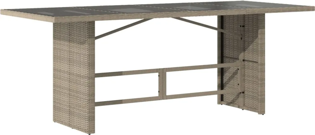Grande table de repas extérieure en résine tressée et plateau en verre