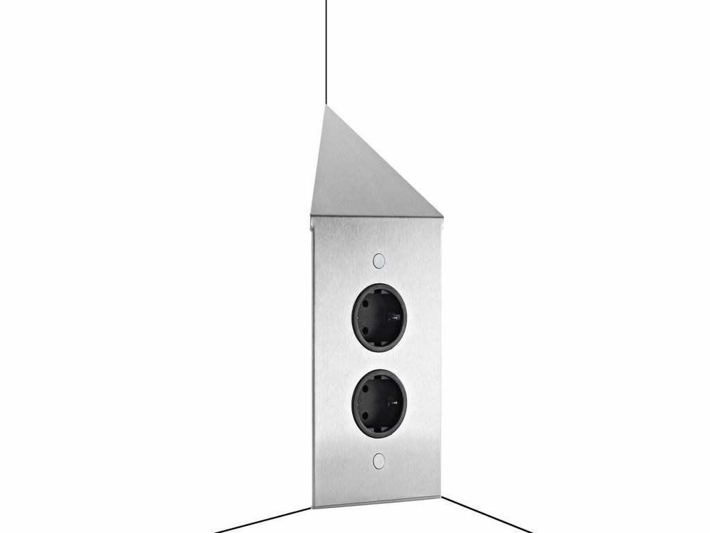 A corner electrical outlet with two sockets, made of brushed stainless steel.