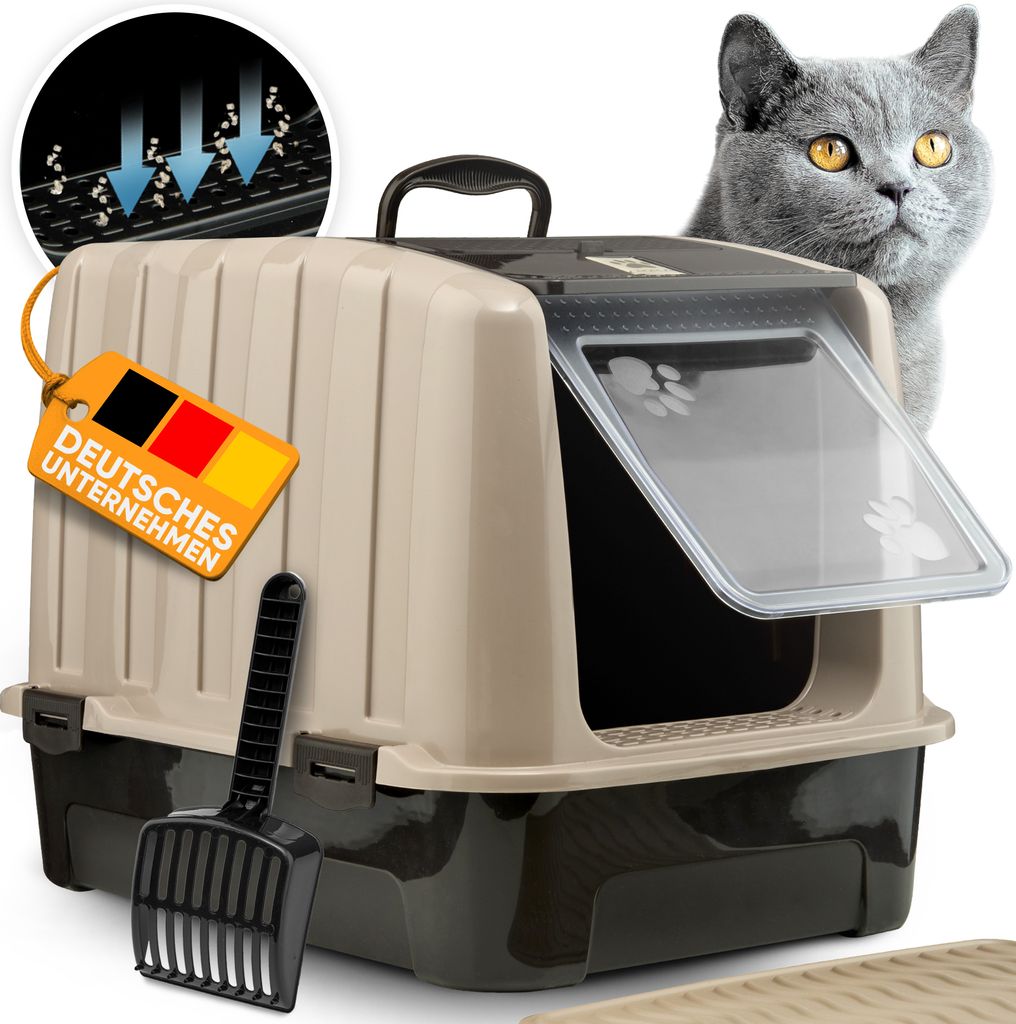 A beige and dark gray enclosed cat litter box with a clear door, a black scoop, and a German flag tag indicating a German company. A grey cat is peeking over the top of the litter box.