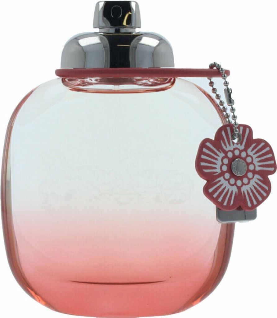 A close-up shot of a Coach Floral Blush Eau de Parfum bottle.