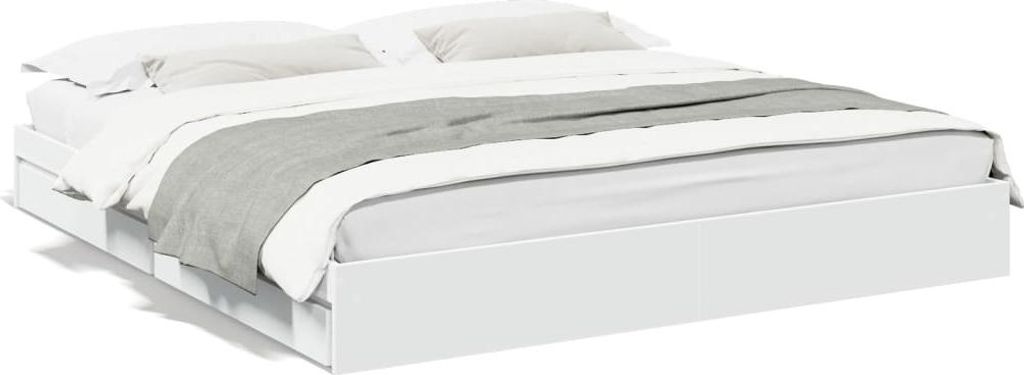 A white bed frame with white and gray bedding.