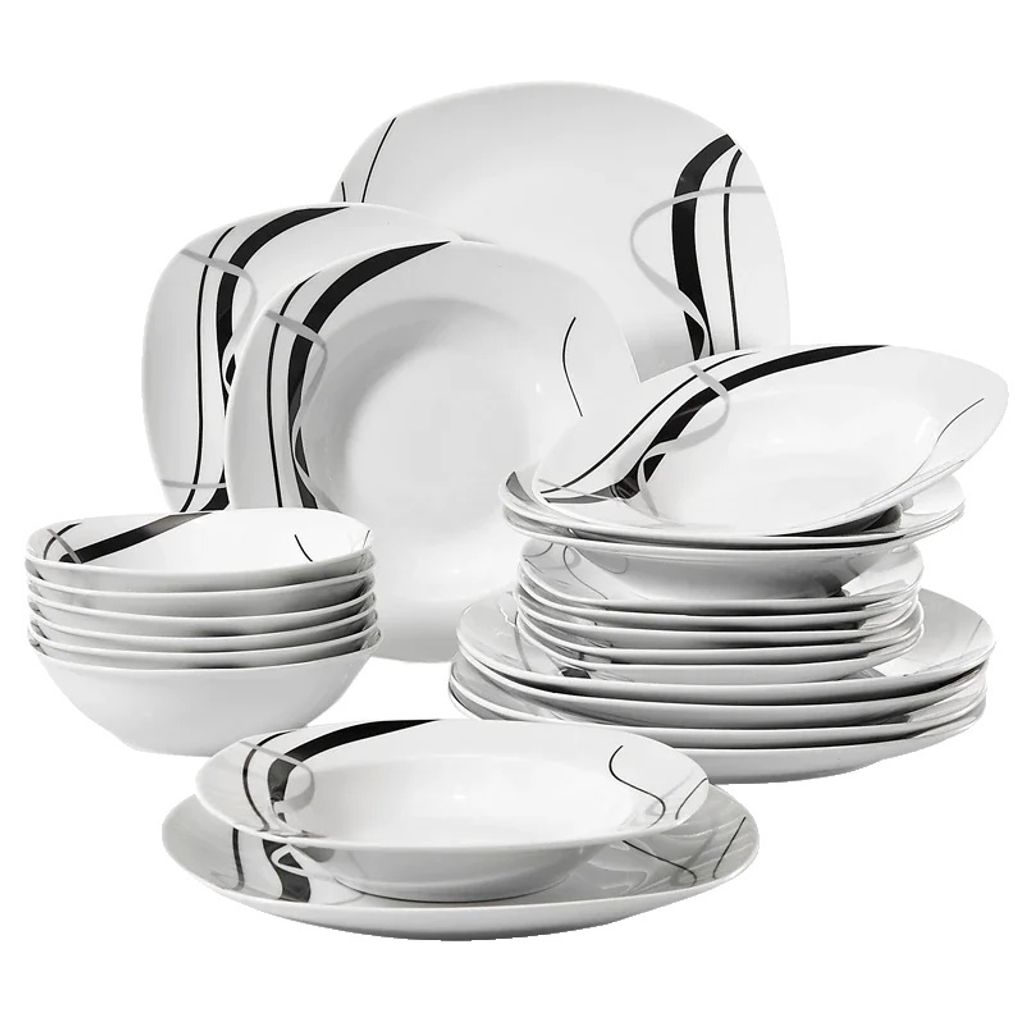 A collection of white ceramic dinnerware with a black and gray abstract design, stacked and arranged.
