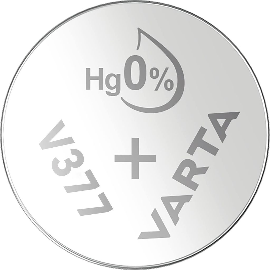 A close-up, top-down view of a silver coin-shaped battery with text and symbols etched onto its surface.