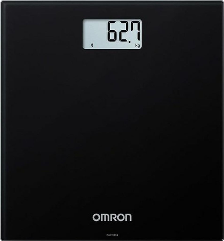 A black digital bathroom scale with a display showing a weight measurement.