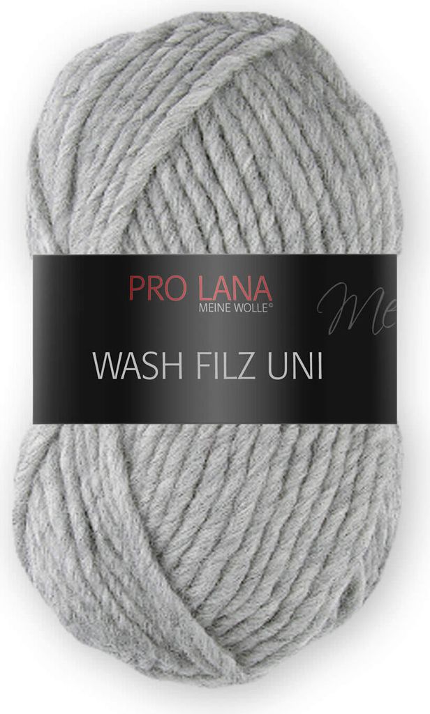 A ball of grey yarn with a black label wrapped around it.