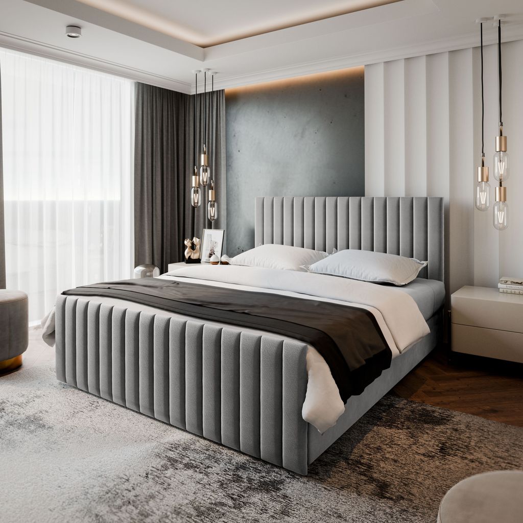 A modern bedroom with a large upholstered bed as the focal point.
