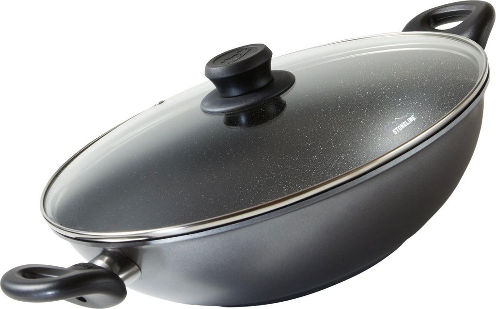 A black wok pan with a glass lid and silver trim, shown from a diagonal angle against a white background.