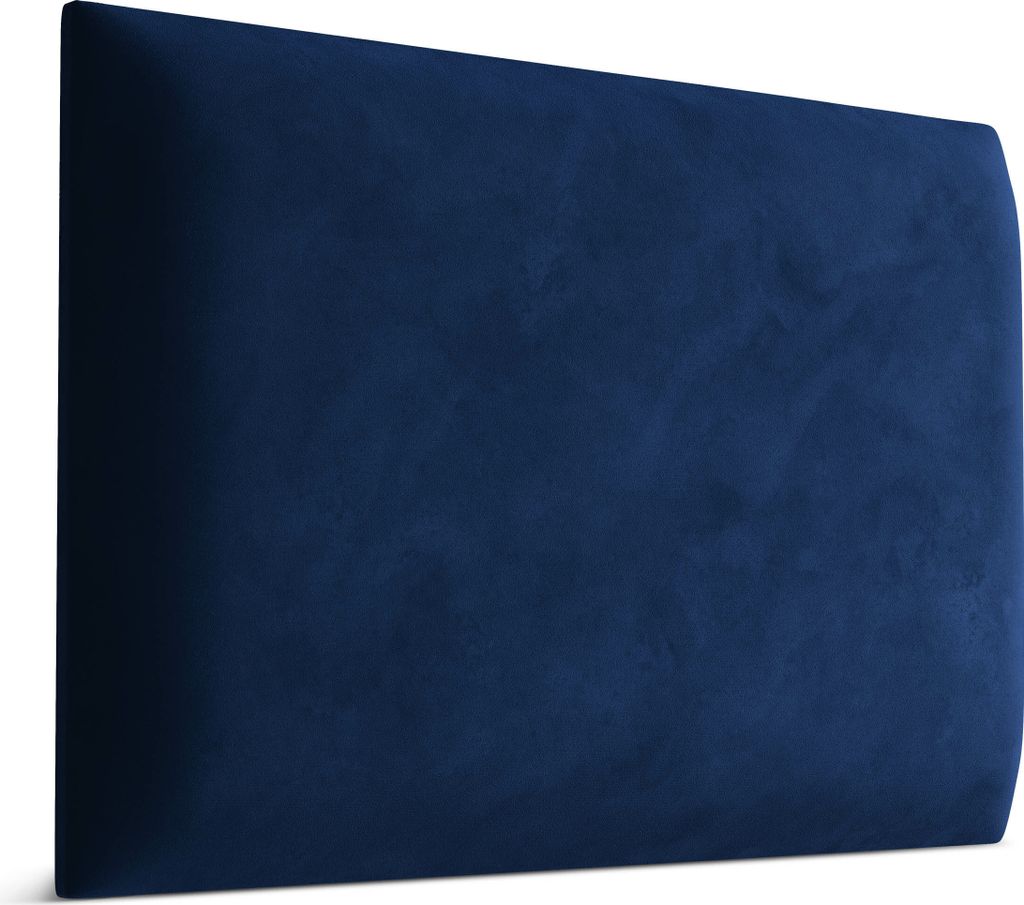 A close-up view of a dark blue velvet headboard.