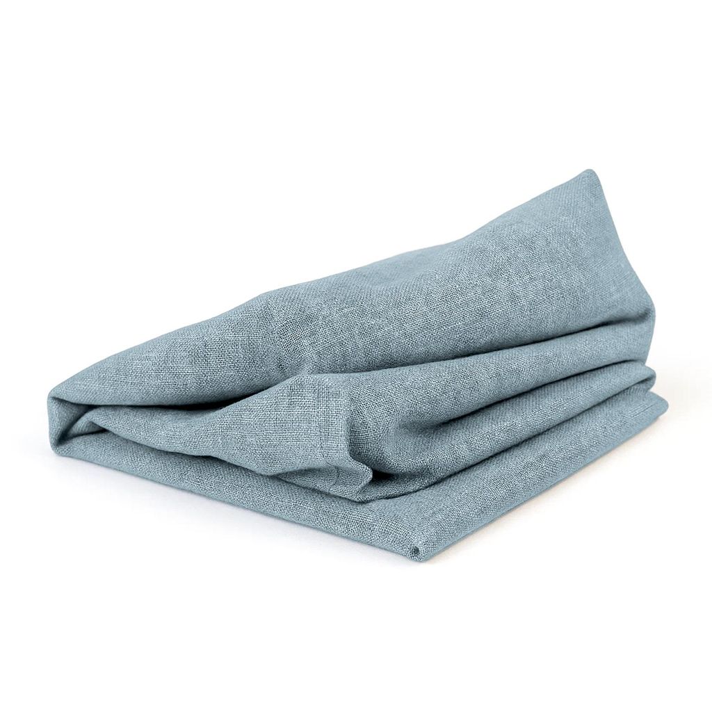 A folded blue fabric item on a white background.