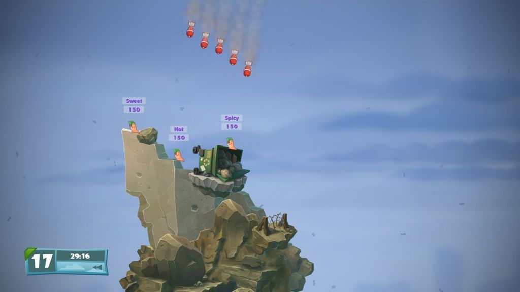 A scene from the video game Worms Battlegrounds, showing worms on a rocky terrain with bombs falling from the sky.