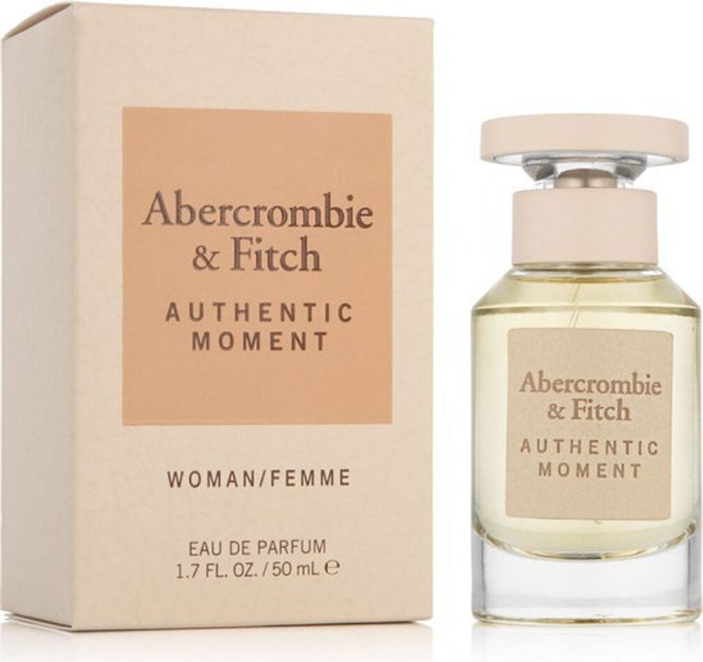 A perfume bottle and its box are displayed side-by-side against a white background.