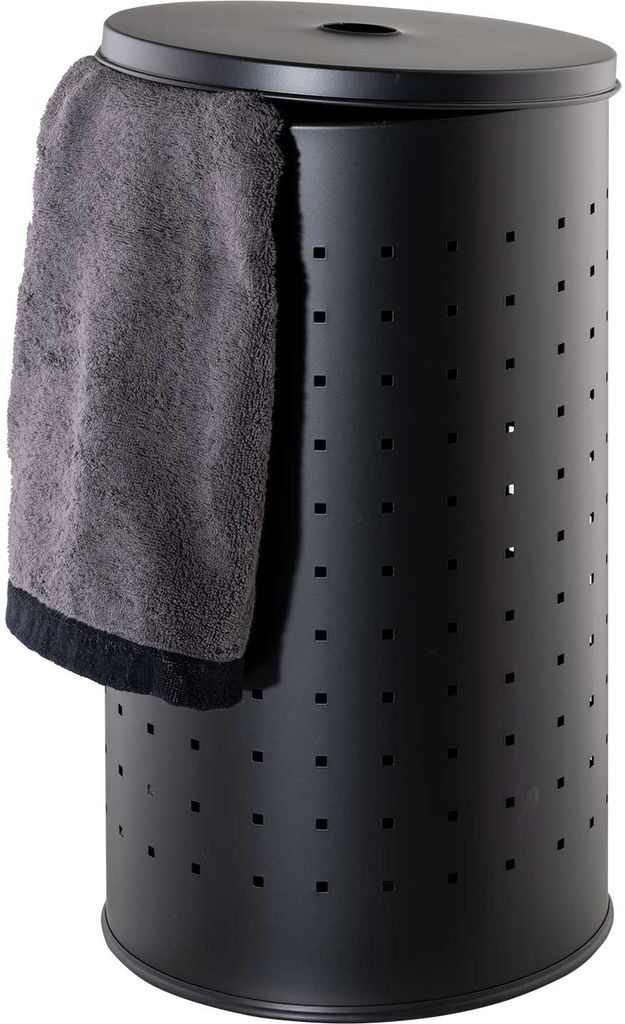 A black laundry hamper with a grey towel draped over the side.