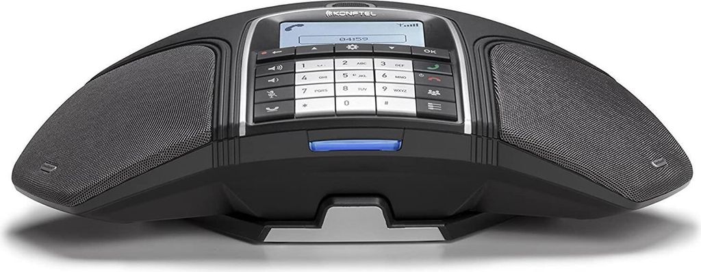 A black Konftel 300Wx conference phone with a digital display and keypad is shown on a white background.