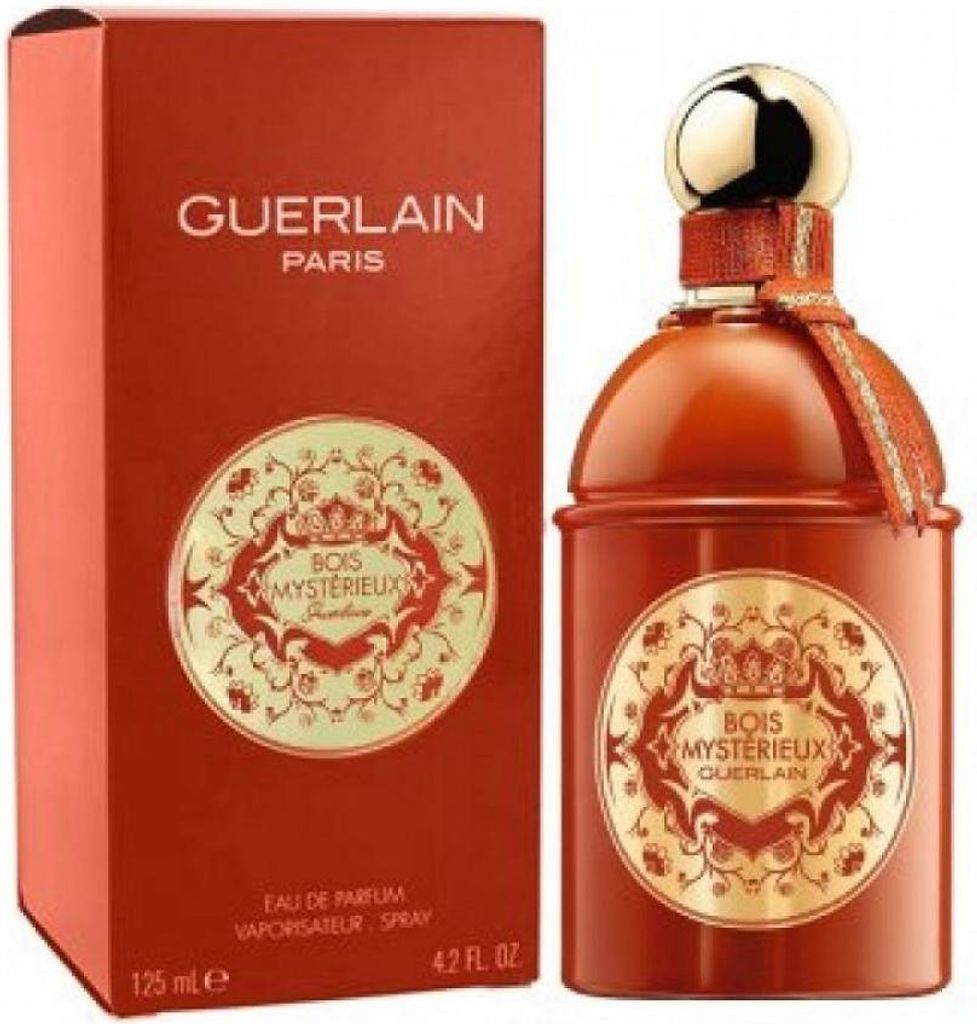 A product shot of Guerlain Bois Mysterieux Eau de Parfum and its packaging.
