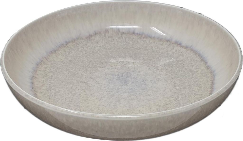 A close-up, overhead view of a beige ceramic pasta bowl with a speckled interior and a slightly darker rim.