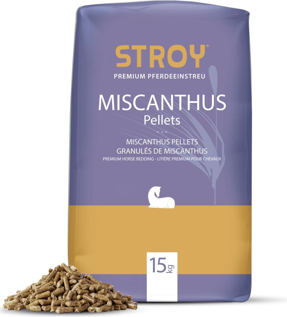 A bag of Miscanthus pellets for horse bedding, with a pile of pellets in front.
