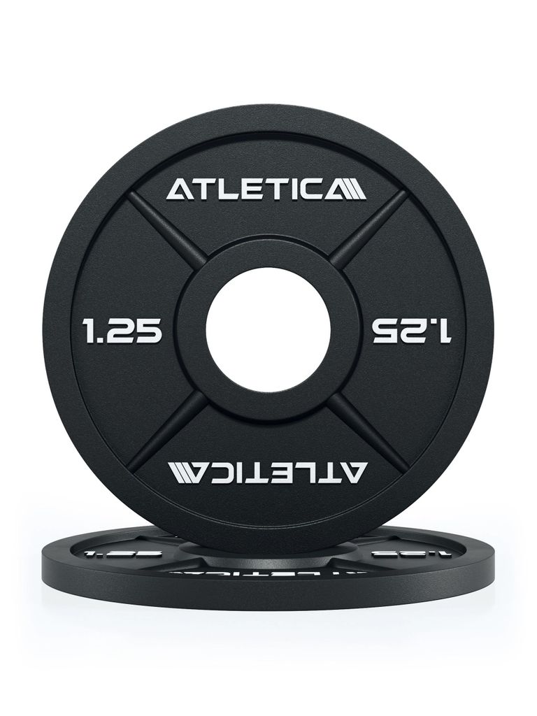 Two black weight plates are stacked on a white background. The top plate is angled towards the viewer.