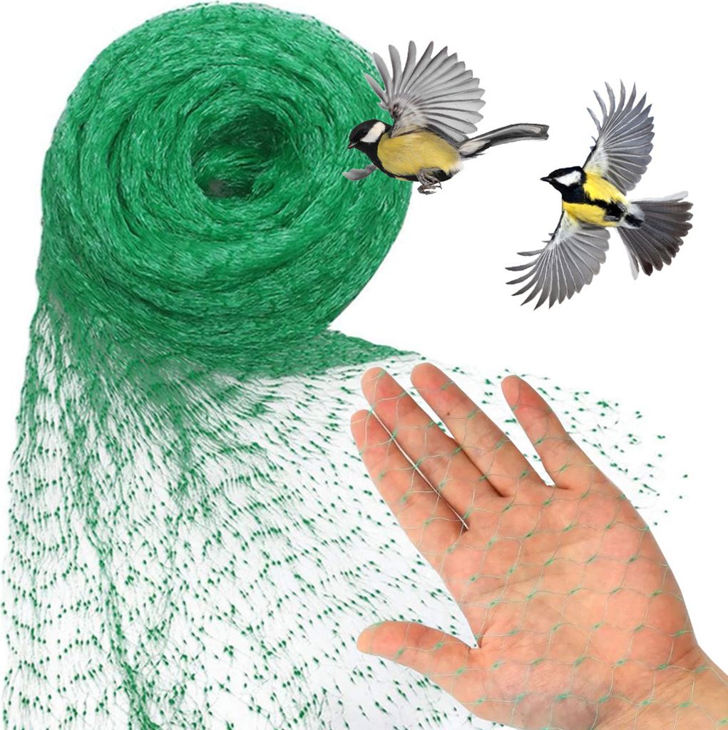 A hand is holding a green bird net, with two birds flying in the background.