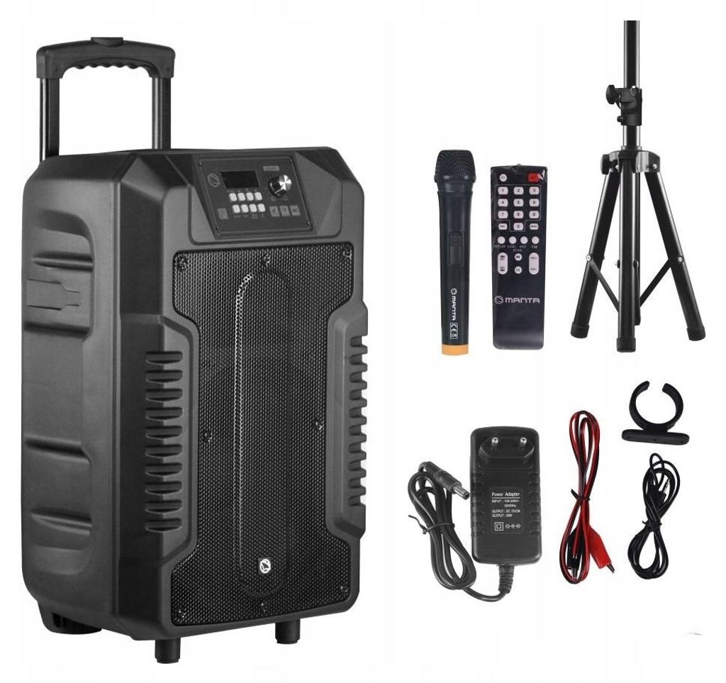 A portable speaker with accessories laid out around it.