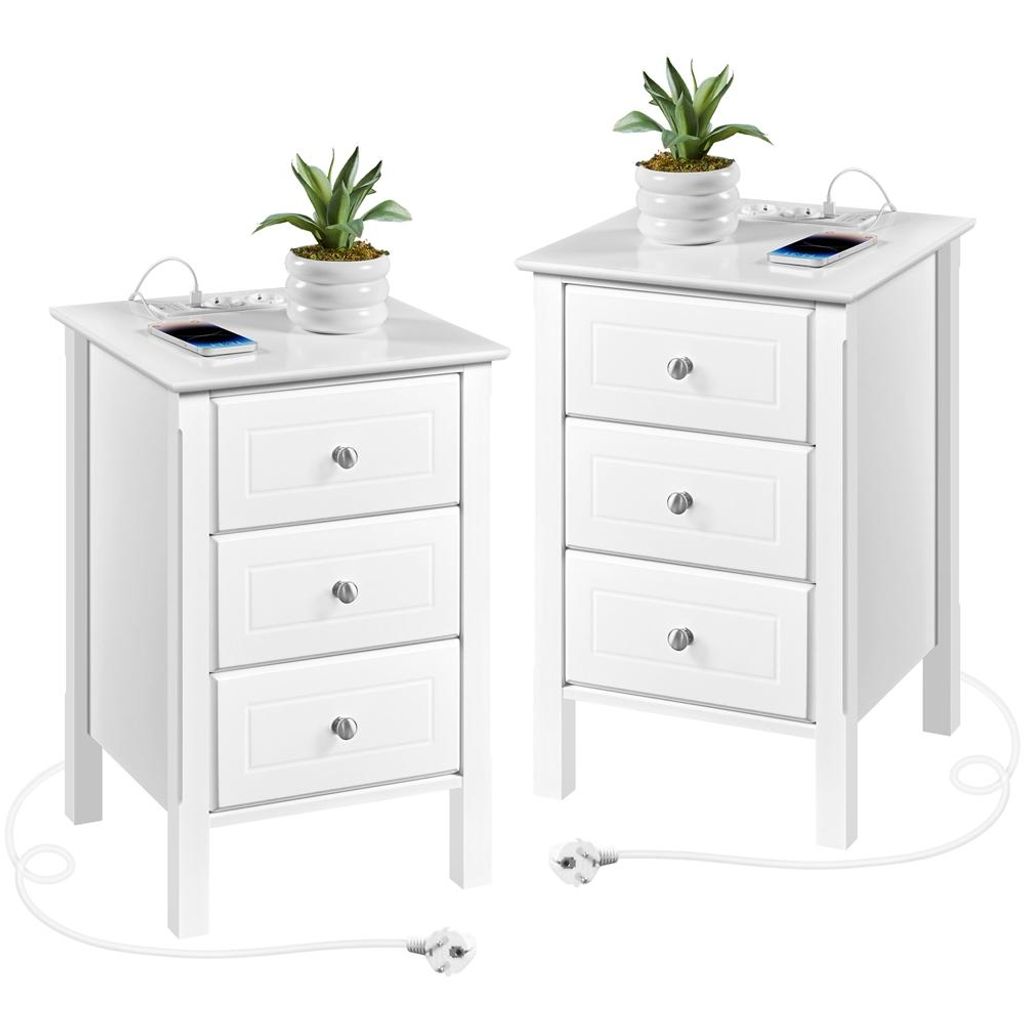 Two white nightstands with built-in charging ports and USB ports, each topped with a small potted plant and a smartphone.