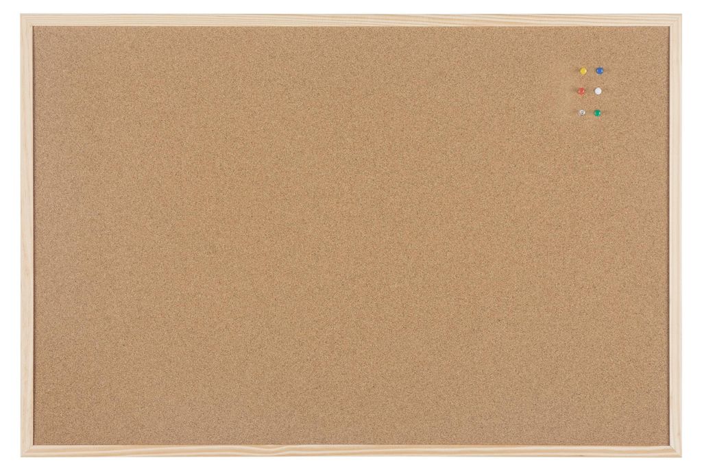 A cork board with a wooden frame and a few push pins on the top right corner.