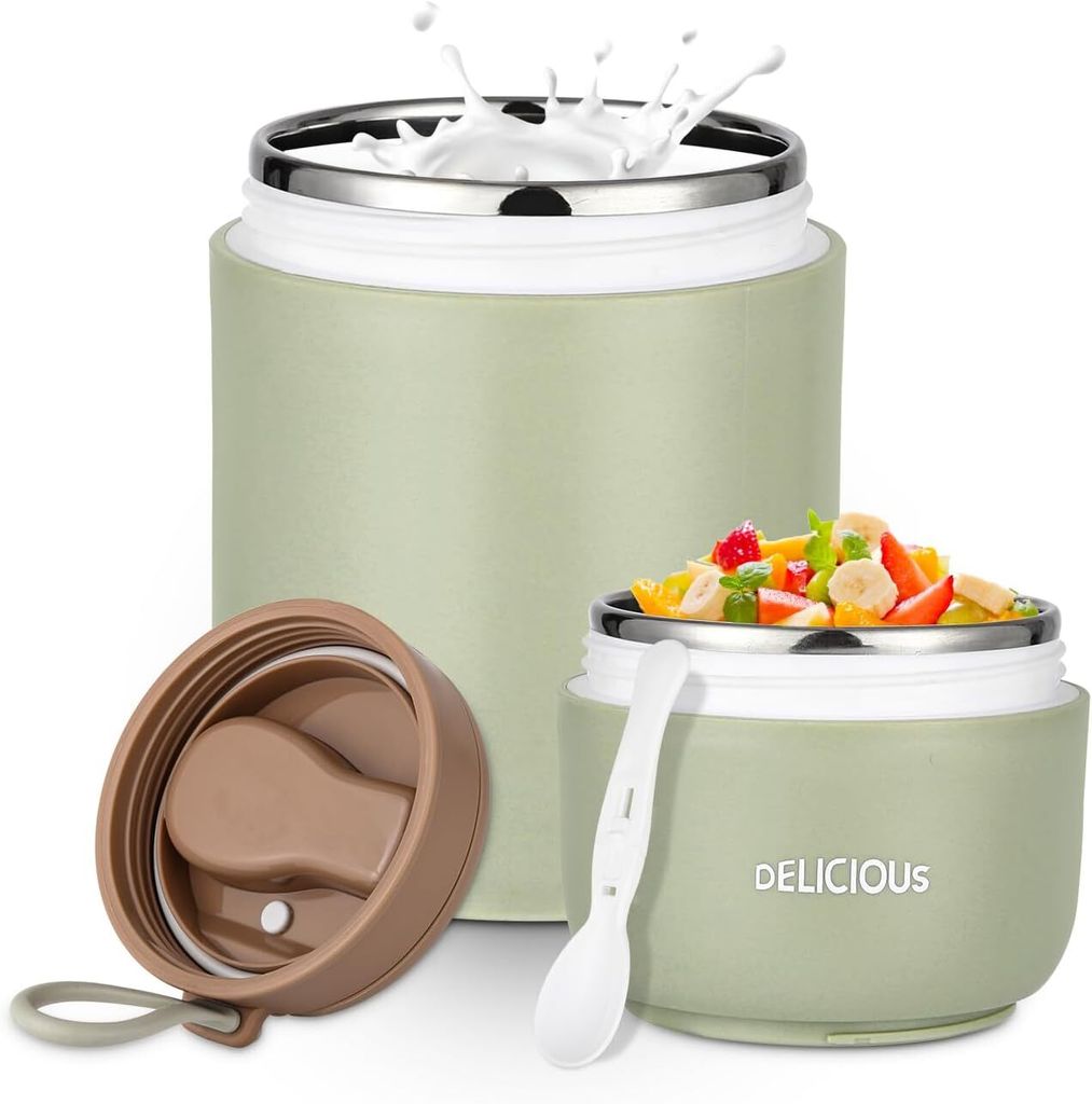 Two food containers, one with a lid off, and a spoon. One container is filled with fruit salad, and the other has milk splashing into it.