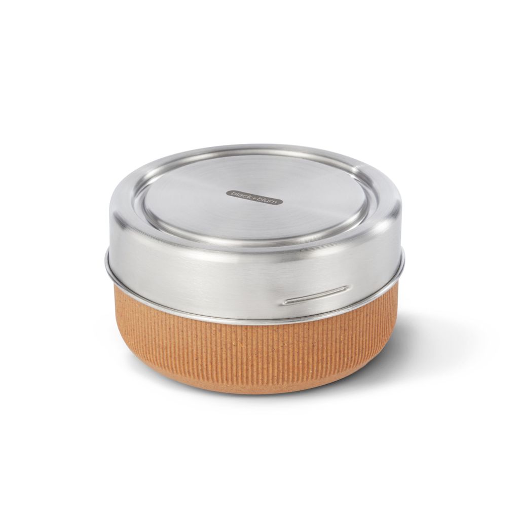 A round lunchbox with a silver lid and a textured brown base, isolated on a white background.