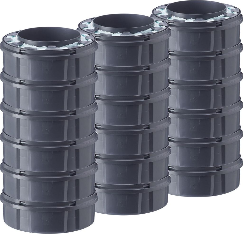Three stacks of cylindrical waste bin refills.