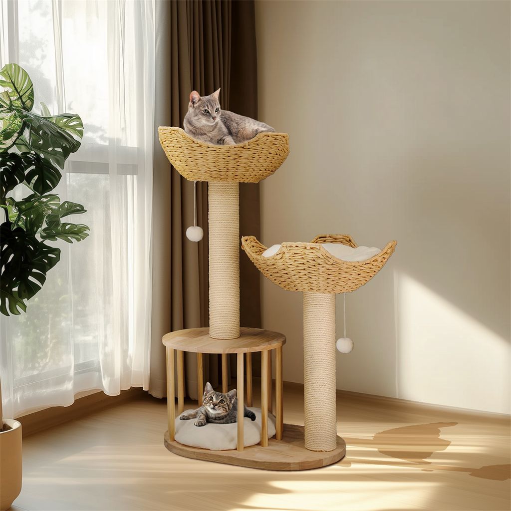 Two cats are relaxing on a multi-level cat tree in a well-lit room with natural light coming through a window.