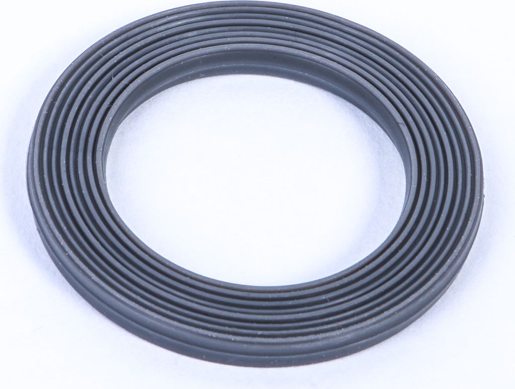 A close-up studio shot of a gray rubber gasket with ribbed texture, isolated on a white background.