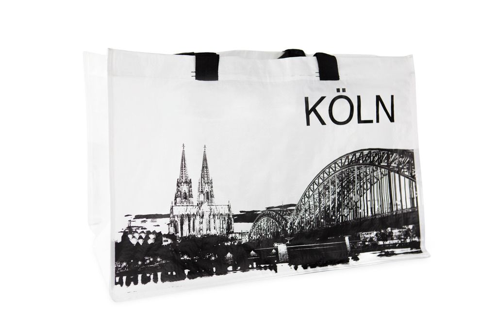 A white shopping bag with a black graphic print of the Cologne Cathedral and Hohenzollern Bridge, and the word "KÖLN".