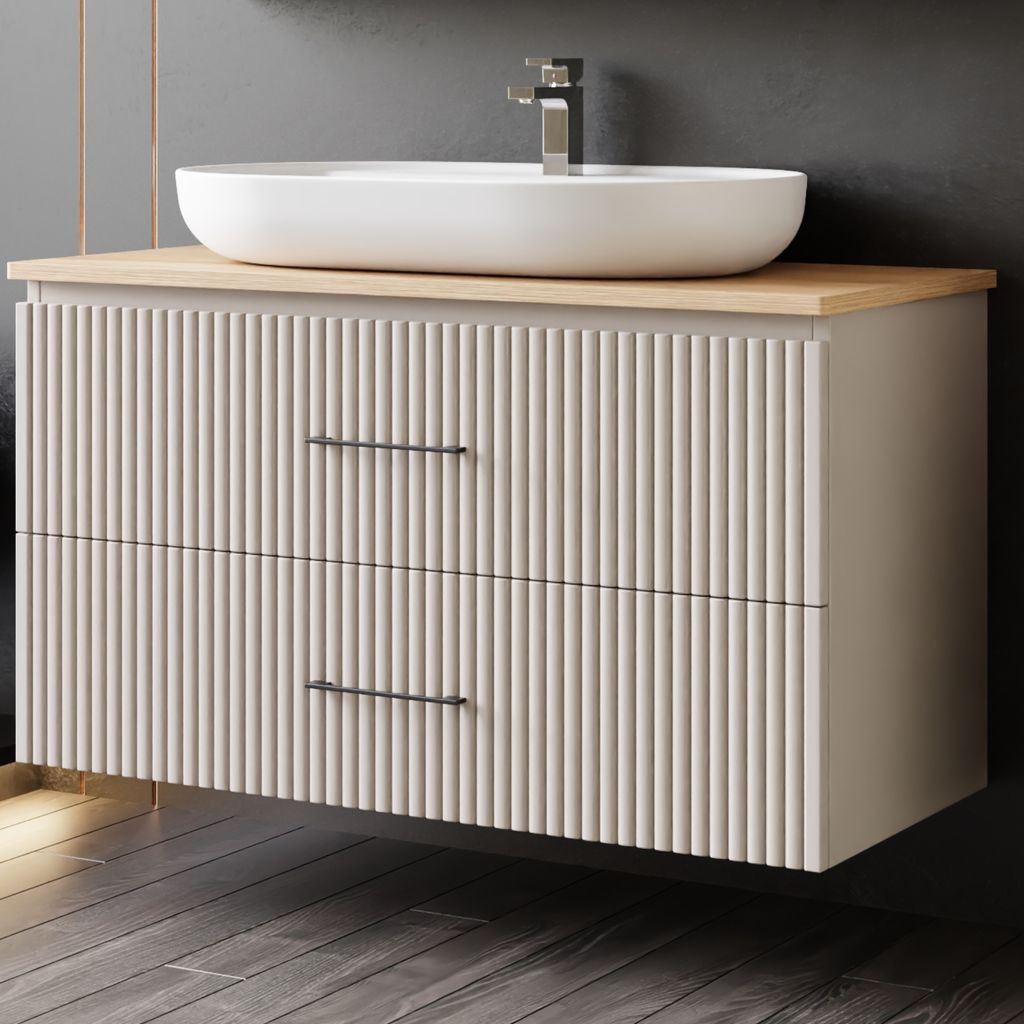 A modern bathroom vanity with a vessel sink and faucet.