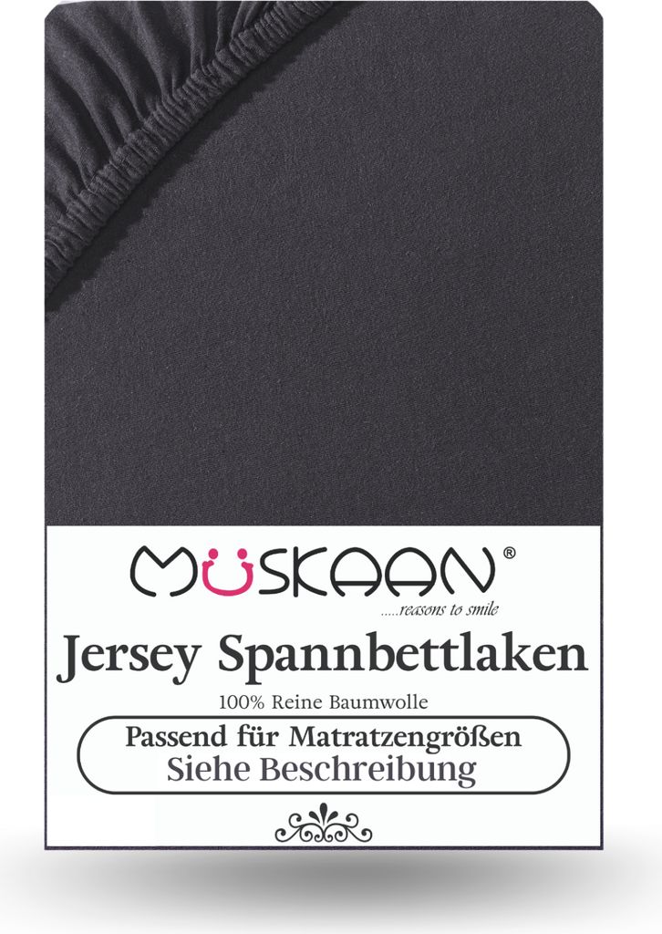 A close-up of a dark gray jersey fitted sheet with a label at the bottom.
