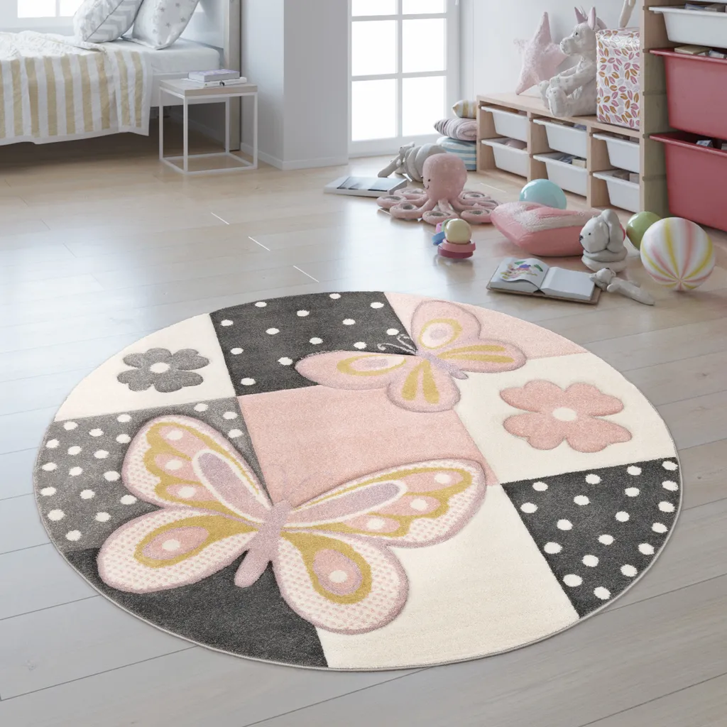 Tapis enfant rond rose Ø 160 cm aux motifs fleurs et papillons colorés