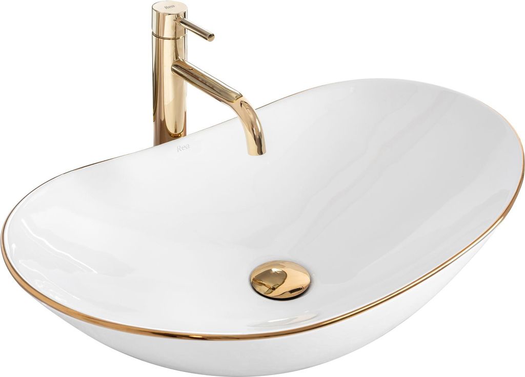 A white oval countertop sink with a gold faucet and drain.