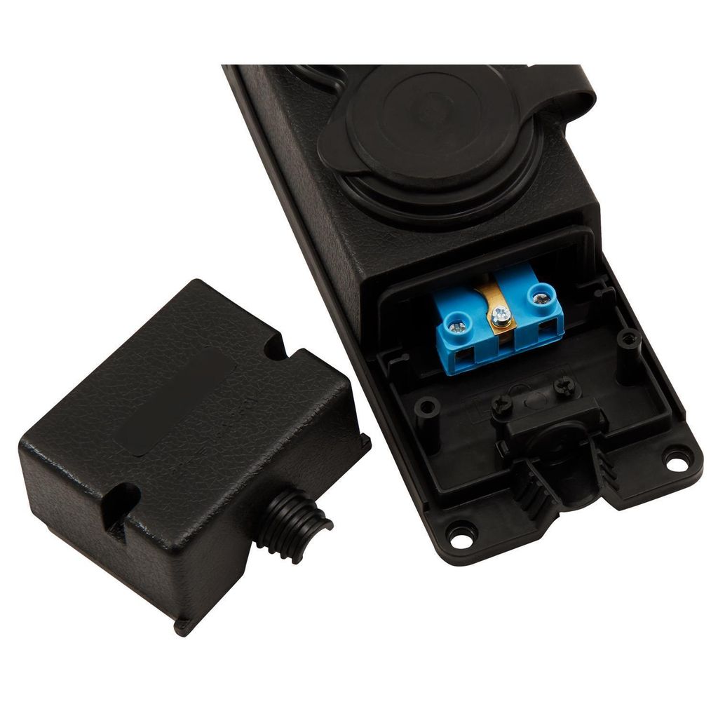 A close-up view of an electrical plug with its cover removed, revealing the internal wiring terminal.