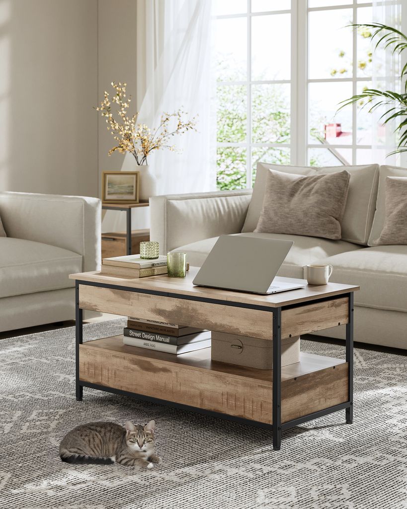 A living room scene with a coffee table, sofa, and armchair.
