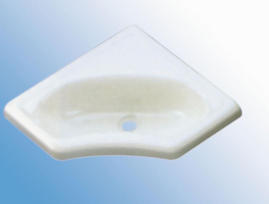 A white corner sink with a drain hole against a gradient blue and white background.