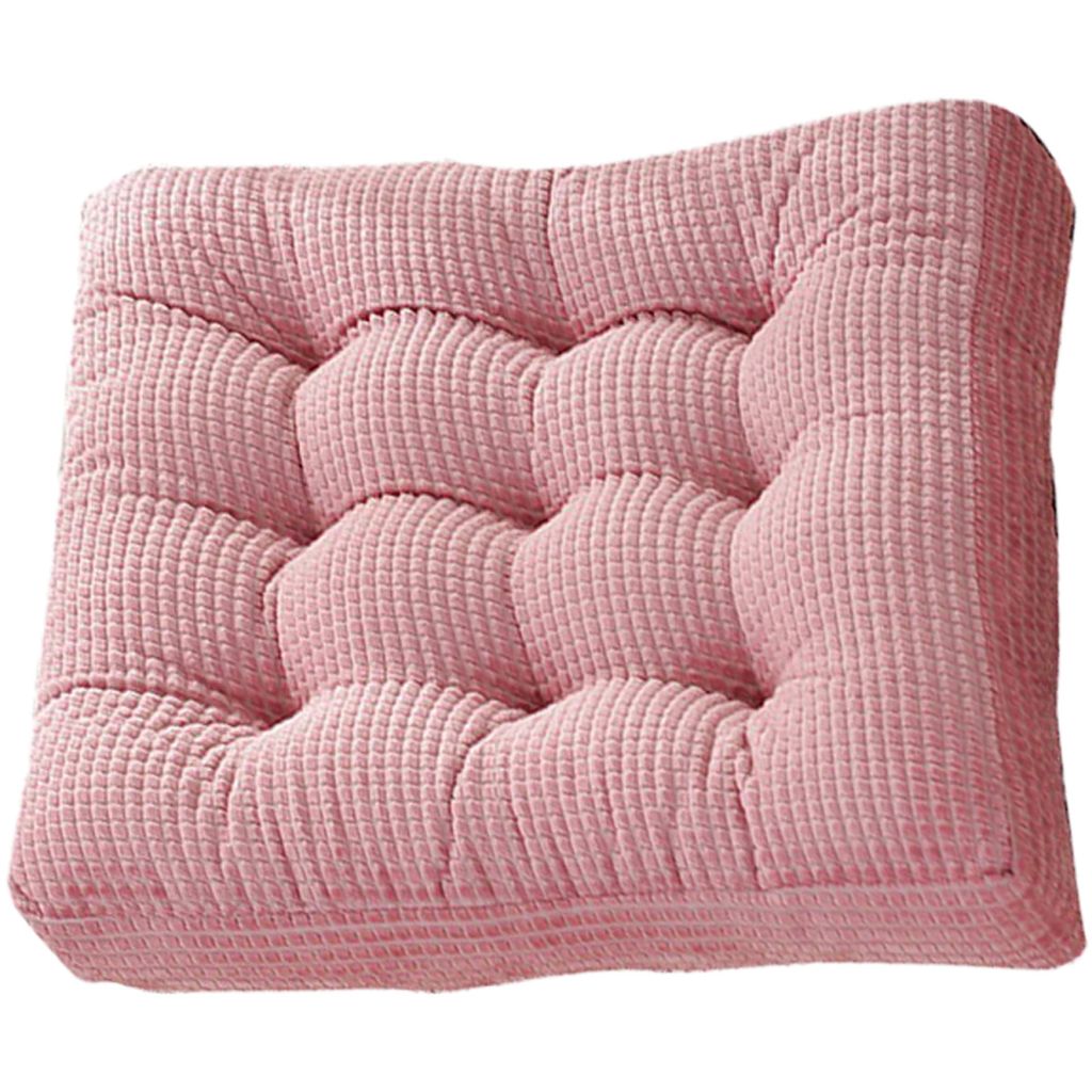 A pink tufted seat cushion.