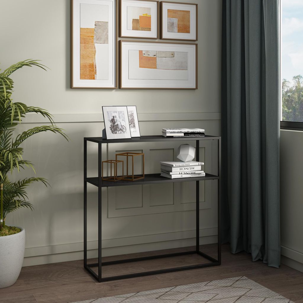 A console table with decorative items and artwork on the wall.