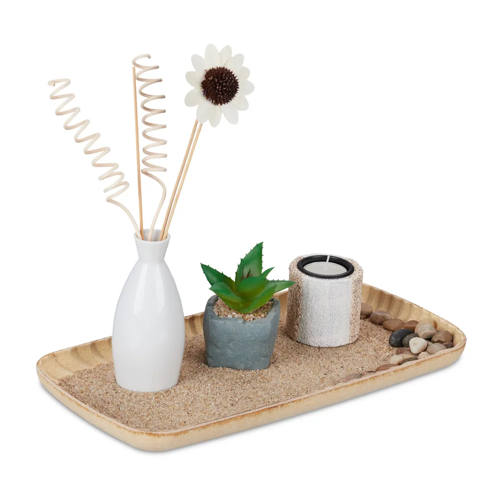 Jardin Zen décoratif avec bougeoirs et galets pour une ambiance Feng Shui