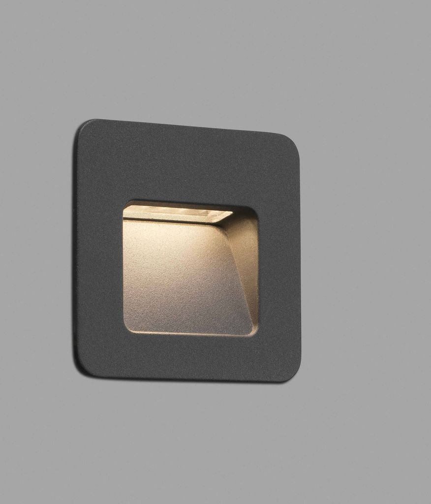 A dark gray square wall light with a recessed light source.
