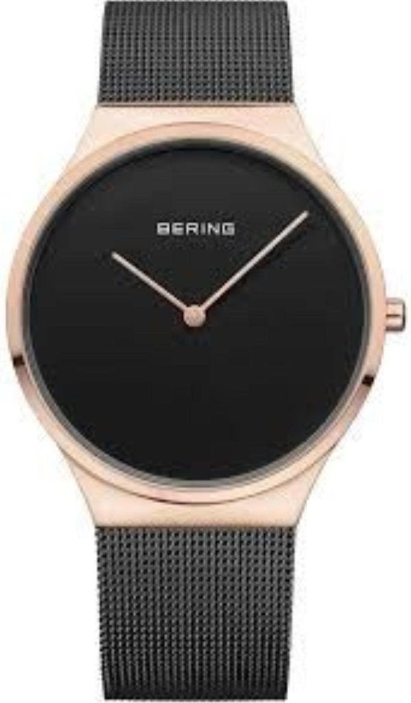 A close-up studio shot of a Bering men's watch with a black dial and rose gold case and mesh strap.