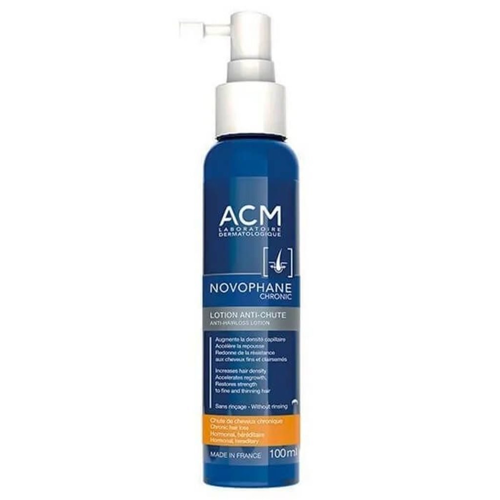 A bottle of hair loss lotion against a white background.