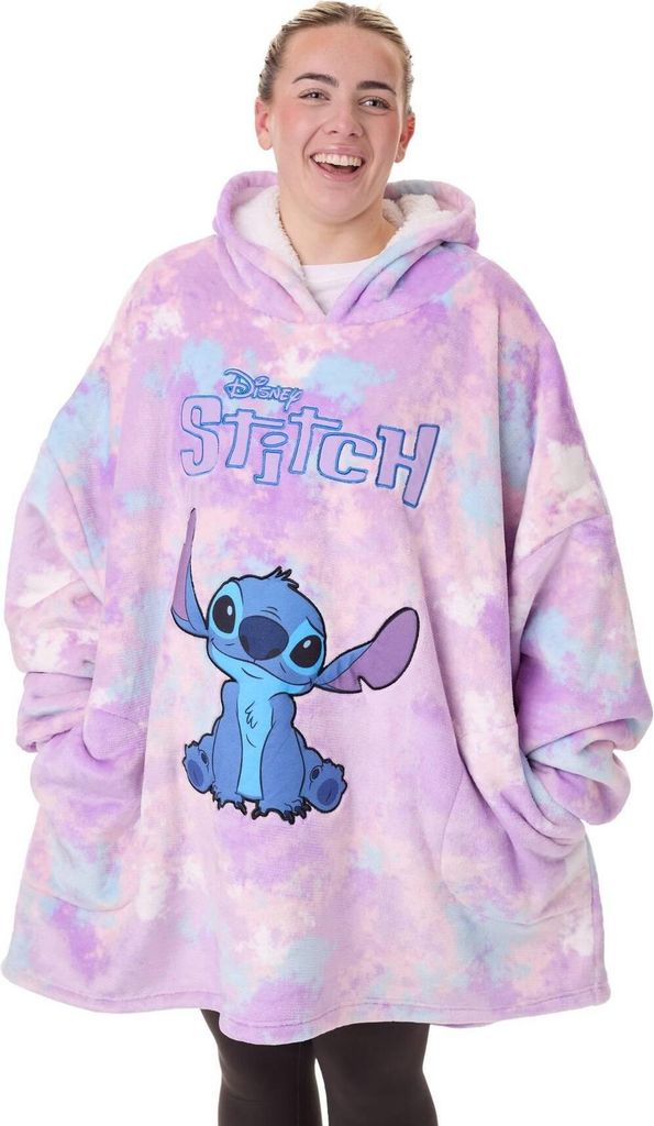 A woman wearing a Lilo & Stitch themed blanket hoodie.
