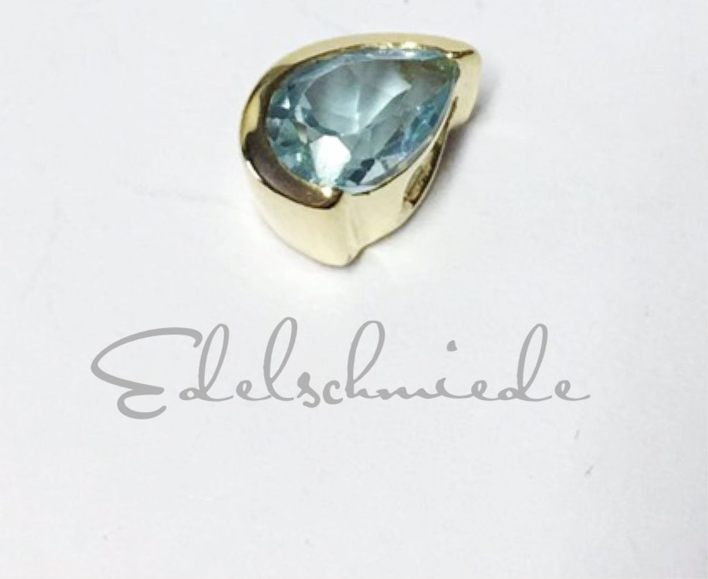 dezenter Anhänger 333/- Gold mit Blautopas (beh.)