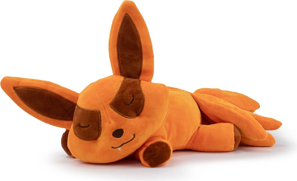 A plush toy of the character Kurama from Naruto Shippuden is lying down on a white background.