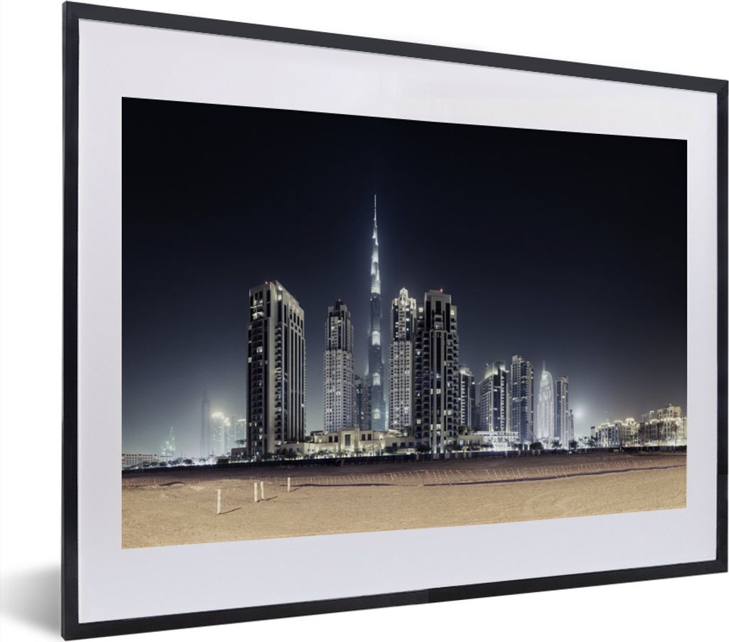 MuchoWow MuchoWow Gerahmtes Poster Der Burj Khalifa erhellt den Himmel über Dubai mit anderen Wolkenkratzern 40x30 cm - Poster mit zchwarzem B...