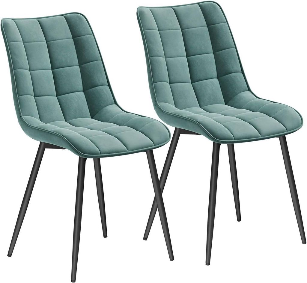 Two turquoise upholstered chairs with black metal legs are shown against a white background.